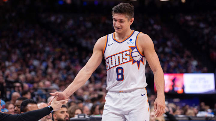 Apr 12, 2024; Sacramento, California, USA; Phoenix Suns guard Grayson Allen (8) high fives coaches as he comes out of the game during the second quarter at Golden 1 Center. Mandatory Credit: Ed Szczepanski-Imagn Images