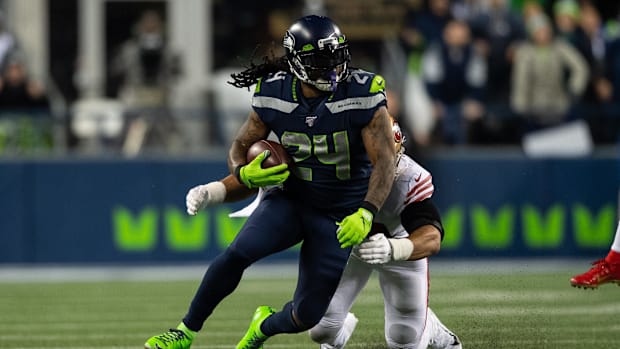 Seattle Seahawks star Marshawn Lynch runs with the football. Seattle Seahawks star Marshawn Lynch runs with the football.