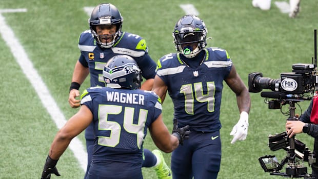 Russell Wilson celebrates with Bobby Wagner.
