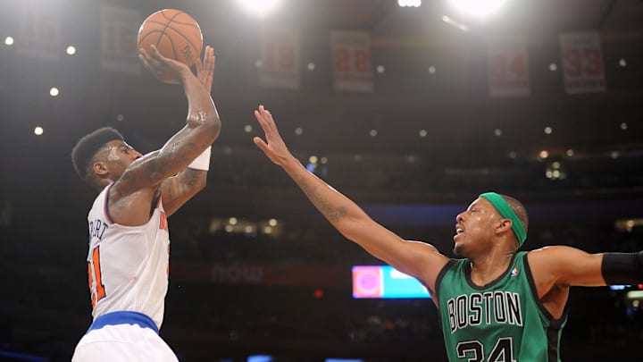 Mar 31, 2013; New York, NY, USA; New York Knicks small forward Iman Shumpert (21) shoots over Boston Celtics small forward Paul Pierce (34) during the second half at Madison Square Garden. Knicks won 108-89. Mandatory Credit: Joe Camporeale-Imagn Images