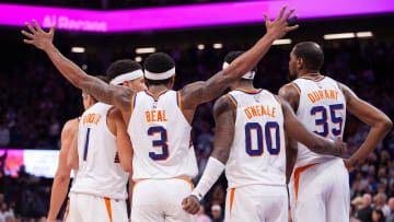 Apr 12, 2024; Sacramento, California, USA; Phoenix Suns guard Grayson Allen (8) and guard Devin Booker (1) and guard Bradley Beal (3) and forward Royce O'Neale (00) and forward Kevin Durant (35) huddle up before the final seconds of the fourth quarter at Golden 1 Center. Mandatory Credit: Ed Szczepanski-USA TODAY Sports