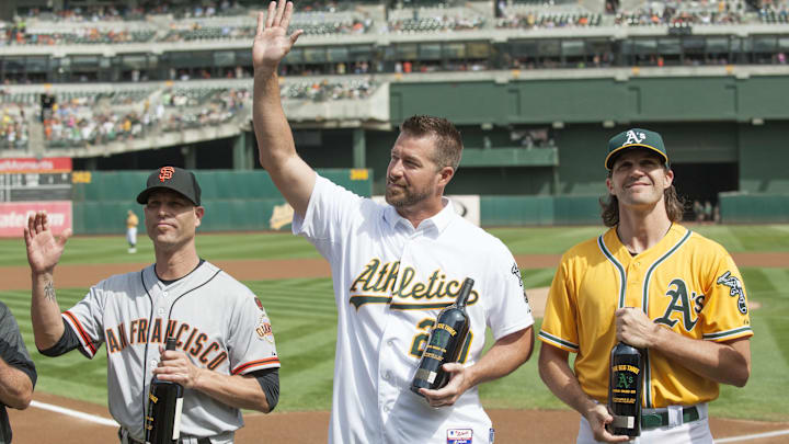 Sep 27, 2015; Oakland, CA, USA; San Francisco Giants starting pitcher Tim Hudson (17) and Oakland Athletics former starting pitcher Mark Mulder and Athletics starting pitcher Barry Zito (75) accept gifts from the Oakland Athletics before the game at O.co Coliseum. Mandatory Credit: Ed Szczepanski-Imagn Images Sep 27, 2015; Oakland, CA, USA; San Francisco Giants starting pitcher Tim Hudson (17) and Oakland Athletics former starting pitcher Mark Mulder and Athletics starting pitcher Barry Zito (75) accept gifts from the Oakland Athletics before the game at O.co Coliseum. Mandatory Credit: Ed Szczepanski-Imagn Images
