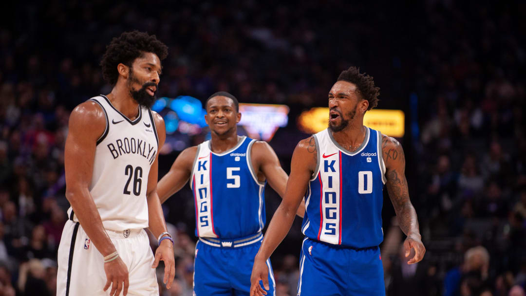 Dec 11, 2023; Sacramento, California, USA; Brooklyn Nets guard Spencer Dinwiddie (26) and Sacramento Kings guard Malik Monk (0) and guard De'Aaron Fox (5) discuss the previous play during the third quarter at Golden 1 Center. Mandatory Credit: Ed Szczepanski-USA TODAY Sports