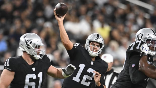 Las Vegas Raiders quarterback Aidan O'Connell (12) throws the ball against the Dallas Cowboys in the third quarter at Allegia