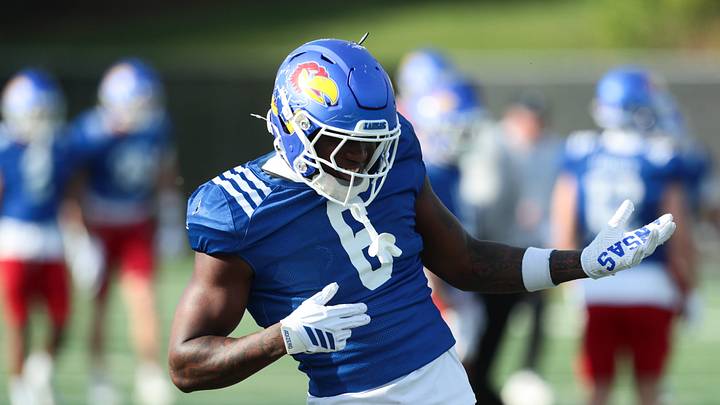 Kansas redshirt junior running back Yasin Willis (6) jams to the music during practice at the University of Kansas on Thursday, April 9, 2026.