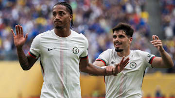 Joao Pedro (L) of Chelsea FC makes an apologetic gesture...