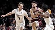 Nov 6, 2025; College Station, Texas, USA;  Texas Southern Tigers guard Ahmed Nedal Abdelrahman (15) drives to the basket as Texas A&M Aggies forward Zach Clemence (7) and guard Josh Holloway (1) defend during the second half at Reed Arena. Mandatory Credit: Maria Lysaker-Imagn Images 