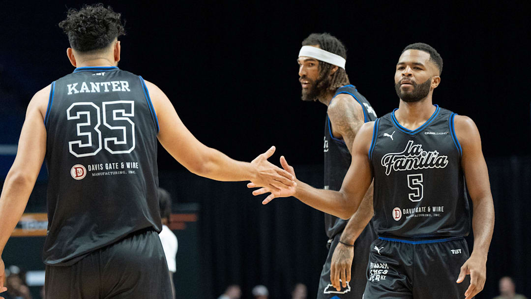 La Familia's Kerem Kanter (35) celebrates a play with Andrew Harrison (5) during their game against the 305 Ballers on Friday, July 19, 2024 in Lexington, Ky. at Rupp Arena during the first round of The Basketball Tournament.