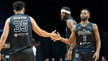 La Familia's Kerem Kanter (35) celebrates a play with Andrew Harrison (5) during their game against the 305 Ballers on Friday, July 19, 2024 in Lexington, Ky. at Rupp Arena during the first round of The Basketball Tournament.