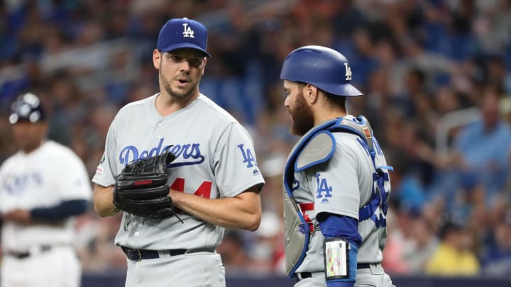 May 22, 2019; St. Petersburg, FL, USA; Los Angeles Dodgers starting pitcher Rich Hill (44) and catcher Russell Martin (55) talk at Tropicana Field. Mandatory Credit: Kim Klement-USA TODAY Sports