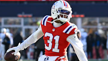Dec 1, 2024; Foxborough, Massachusetts, USA; New England Patriots cornerback Jonathan Jones (31) warms up before a game against the Indianapolis Colts at Gillette Stadium. Mandatory Credit: Eric Canha-Imagn Images