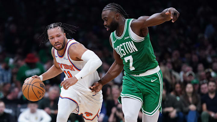 Oct 22, 2024; Boston, Massachusetts, USA; Boston Celtics guard Jaylen Brown (7) defends against New York Knicks guard Jalen Brunson (11) in the second half at TD Garden. Mandatory Credit: David Butler II-Imagn Images