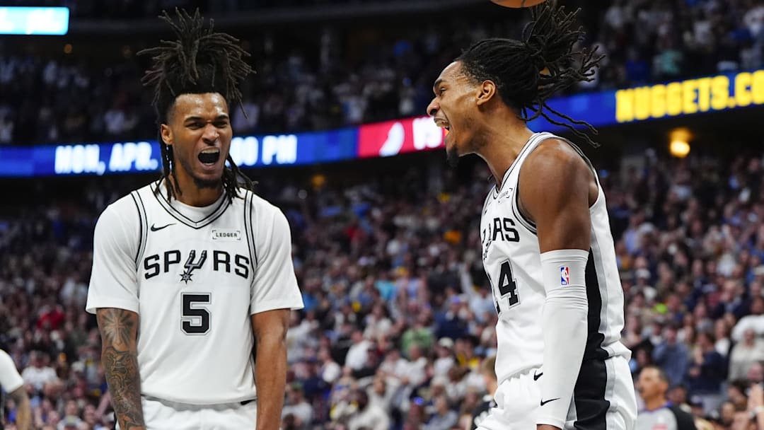 Apr 4, 2026; Denver, Colorado, USA; San Antonio Spurs guard Stephon Castle (5) and guard Devin Vassell (24) react in the fourth quarter against the Denver Nuggets at Ball Arena. Mandatory Credit: Ron Chenoy-Imagn Images