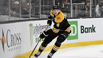 Mar 15, 2025; Boston, Massachusetts, USA; Boston Bruins defenseman Mason Lohrei (6) with the puck during the second period against the Tampa Bay Lightning at TD Garden. Mandatory Credit: Eric Canha-Imagn Images
