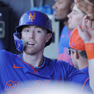 Feb 23, 2025; Port St. Lucie, Florida, USA;  New York Mets third baseman Brett Baty (7) celebrates in the dugout after scoring on a balk during the fourth inning against the Miami Marlins at Clover Park. Mandatory Credit: Reinhold Matay-Imagn Images