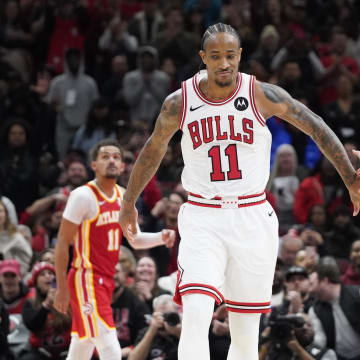 Dec 26, 2023; Chicago, Illinois, USA; Chicago Bulls forward DeMar DeRozan (11) celebrates his three point basket with guard Alex Caruso (6) during the second half against the Atlanta Hawks at United Center. 