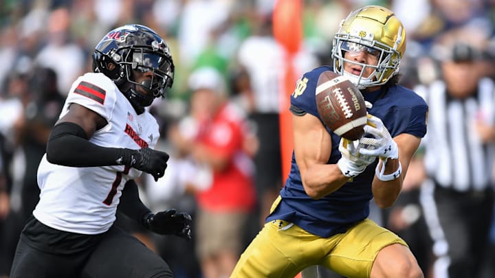 Sep 7, 2024; South Bend, Indiana, USA; Notre Dame Fighting Irish wide receiver Jaden Greathouse (1) attempts to catch a pass as Northern Illinois Huskies defensive back Jashon Prophete (1) defends in the second quarter at Notre Dame Stadium. 