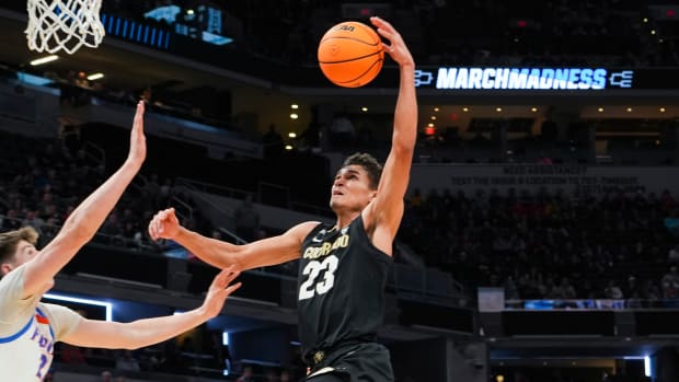 Colorado Buffaloes forward Tristan da Silva (23) dunks the ball over Florida Gators forward Alex Condon (21) on Friday, March 22, 2024, during the first round of the NCAA Men’s Basketball Tournament at Gainbridge Fieldhouse in Indianapolis. The Colorado Buffaloes defeated the Florida Gators 102-100.