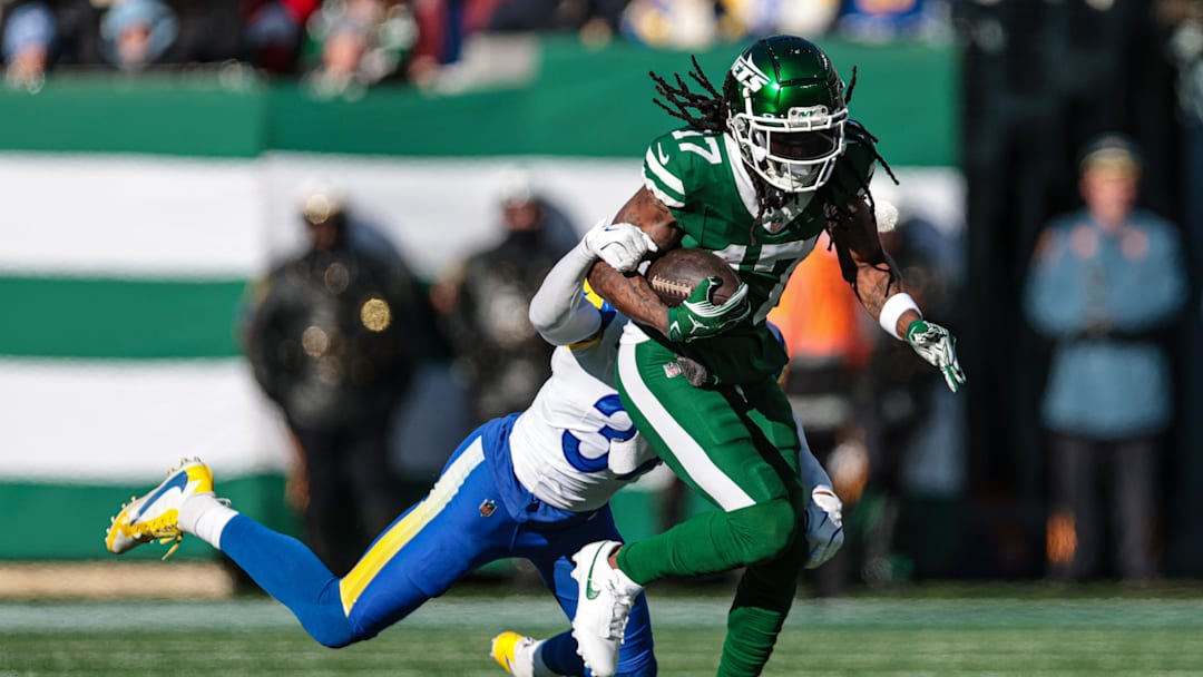 New York Jets wide receiver Davante Adams fights for yards  as Los Angeles Rams safety Quentin Lake tackles during the first half at MetLife Stadium.