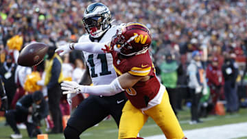 Dec 22, 2024; Landover, Maryland, USA; Washington Commanders cornerback Marshon Lattimore (23) defends a pass intended for Philadelphia Eagles wide receiver A.J. Brown (11) during the first quarter at Northwest Stadium. Mandatory Credit: Geoff Burke-Imagn Images