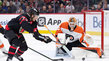 Nov 14, 2024; Ottawa, Ontario, CAN; Philadelphia Flyers goalie Ivan Fedotov (82) makes a save on a shot from Ottawa Senators left wing Noah Gregor (73) in the first period at the Canadian Tire Centre.