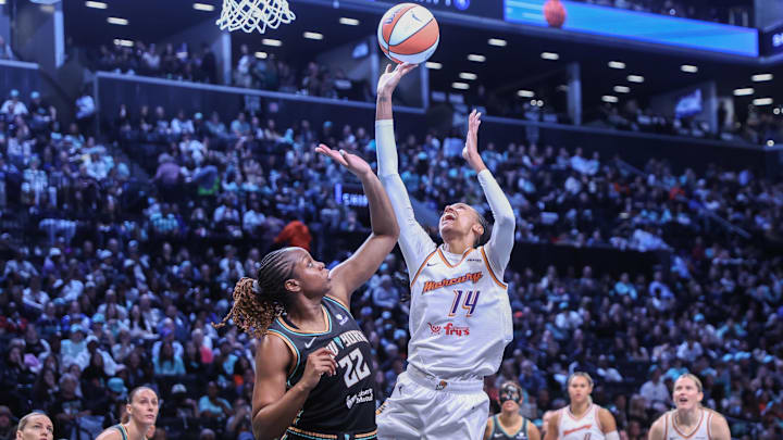 Sep 17, 2025; Brooklyn, New York, USA; Phoenix Mercury forward DeWanna Bonner (14) shoots over New York Liberty forward Kennedy Burke (22) during game two of round one for the 2025 WNBA Playoffs at Barclays Center. Mandatory Credit: Wendell Cruz-Imagn Images