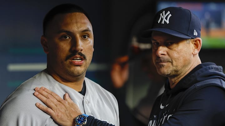 May 30, 2023; Seattle, Washington, USA; New York Yankees manager Aaron Boone (17, right) talks with starting pitcher Nestor Cortes (65) following the fifth inning against the Seattle Mariners at T-Mobile Park. Mandatory Credit: Joe Nicholson-Imagn Images