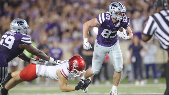 Kansas State Wildcats tight end Will Swanson (83) looks for yards on a play during the third quarter of the game against Arizona at Bill Snyder Family Stadium on Friday, September 13, 2024.