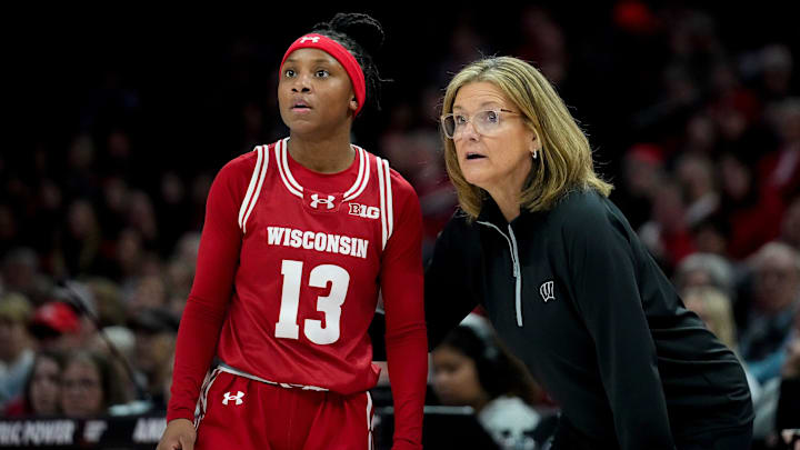 Wisconsin Badgers guard Ronnie Porter (13) speaks with head coach Robin Pingeton in the first half of the NCAA basketball game at Value City Arena on Thursday, Jan. 29, 2026 in Columbus, Ohio.