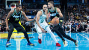 Dec 4, 2023; Indianapolis, Indiana, USA; Indiana Pacers guard Tyrese Haliburton (0) dribbles while Boston Celtics guard Derrick White (9) defends in the second half at Gainbridge Fieldhouse. Mandatory Credit: Trevor Ruszkowski-USA TODAY Sports
