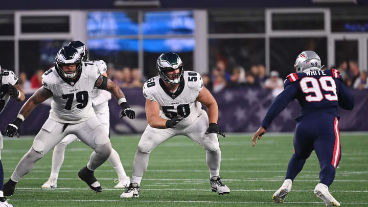 Aug 15, 2024; Foxborough, MA, USA; Philadelphia Eagles guard Max Scharping (50)  and guard Trevor Keegan (79)  protect against New England Patriots defensive end Keion White (99) during the first half at Gillette Stadium. Mandatory Credit: Eric Canha-USA TODAY Sports