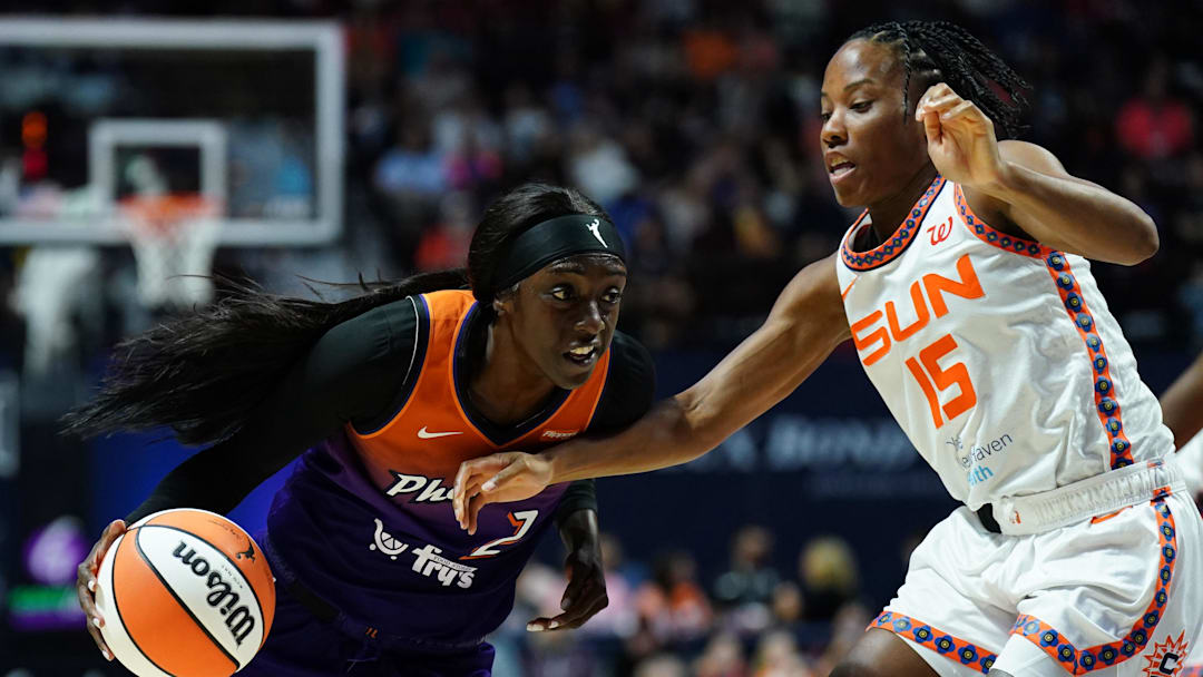Phoenix Mercury guard Kahleah Copper (2) drives the ball against Connecticut Sun guard Lindsay Allen (15) in the second half at Mohegan Sun Arena. 