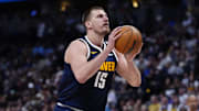 Mar 28, 2025; Denver, Colorado, USA; Denver Nuggets center Nikola Jokic (15) prepares to shoot the ball in the second half against the Utah Jazz at Ball Arena. Mandatory Credit: Ron Chenoy-Imagn Images