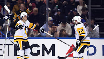 Rickard Rakell (left) celebrates with Bryan Rust (right) during Pittsburgh Penguins v New York Rangers