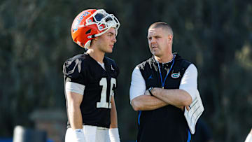 Florida Gators quarterback Aidan Warner (16) talks with Florida Gators head coach Billy Napier during spring football practice at Heavener Football Complex at the University of Florida in Gainesville, FL on Thursday, March 6, 2025. [Matt Pendleton/Gainesville Sun]