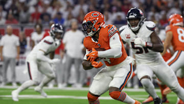 Sep 15, 2024; Houston, Texas, USA;  Chicago Bears running back D'Andre Swift (4) rushes against Houston Texans defensive end Will Anderson Jr. (51) in the first quarter at NRG Stadium. Mandatory Credit: Thomas Shea-Imagn Images
