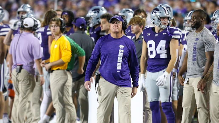 Sep 13, 2024; Manhattan, Kansas, USA; Kansas State Wildcats head coach Chris Klieman looks at the scoreboard during the fourth quarter against the Arizona Wildcats at Bill Snyder Family Football Stadium. Mandatory Credit: Scott Sewell-Imagn Images