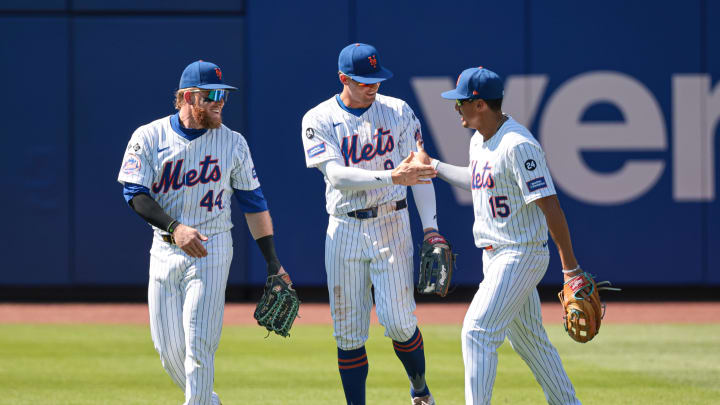 Jul 11, 2024; New York City, New York, USA; New York Mets center fielder Harrison Bader (44) and right fielder Tyrone Taylor (15) and left fielder Brandon Nimmo (9) celebrate after defeating the Washington Nationals  at Citi Field. Mandatory Credit: Vincent Carchietta-USA TODAY Sports