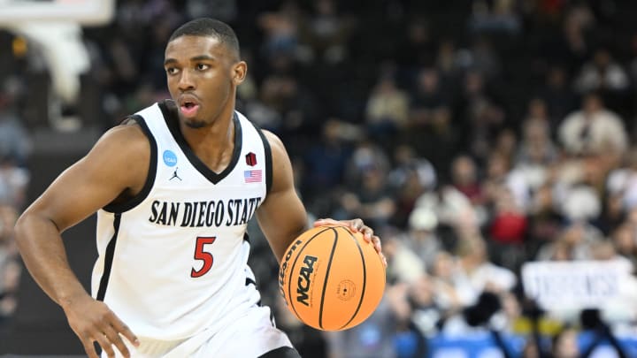 Mar 24, 2024; Spokane, WA, USA; San Diego State Aztecs guard Lamont Butler (5) plays the ball in the first half against the Yale Bulldogs at Spokane Veterans Memorial Arena. Mandatory Credit: James Snook-USA TODAY Sports