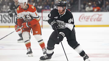 Feb 8, 2025; Los Angeles, California, USA; Los Angeles Kings defenseman Vladislav Gavrikov (84) skates with the puck against the Anaheim Ducks during the second period of a hockey game at Crypto.com Arena. Mandatory Credit: Jessica Alcheh-Imagn Images