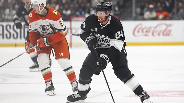 Feb 8, 2025; Los Angeles, California, USA; Los Angeles Kings defenseman Vladislav Gavrikov (84) skates with the puck against the Anaheim Ducks during the second period of a hockey game at Crypto.com Arena. Mandatory Credit: Jessica Alcheh-Imagn Images