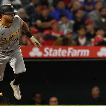Apr 23, 2025; Anaheim, California, USA;  Pittsburgh Pirates left fielder Tommy Pham (28) hits an RBI single during the ninth inning against the Los Angeles Angels at Angel Stadium. Mandatory Credit: Kiyoshi Mio-Imagn Images
