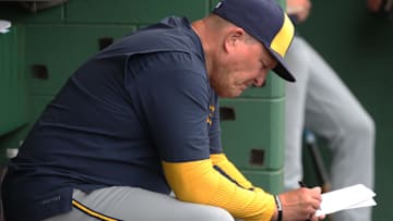 May 25, 2025; Pittsburgh, Pennsylvania, USA;  Milwaukee Brewers manager Pat Murphy (49) writes on his lineup card in the dugout against the Pittsburgh Pirates during the sixth inning at PNC Park. Mandatory Credit: Charles LeClaire-Imagn Images
