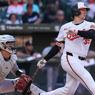 Sep 2, 2024; Baltimore, Maryland, USA; Baltimore Orioles catcher Adley Rutschman follows through on his swing.