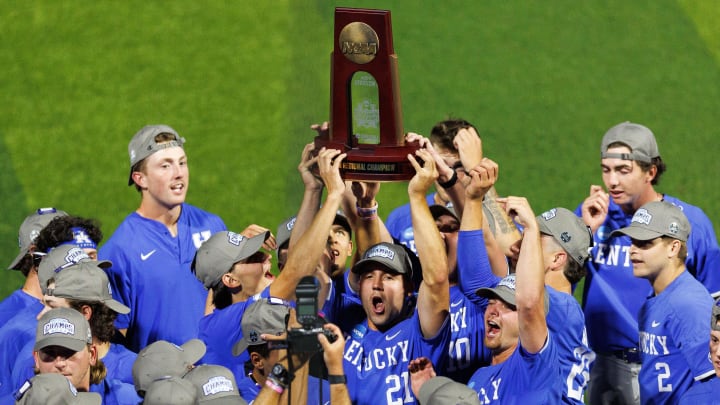 Jun 9, 2024; Lexington, KY, USA; Kentucky Wildcats outfielder Ryan Waldschmidt (21) holds up the NCAA Super Regional Championship trophy after winning against the Oregon State Beavers at Kentucky Proud Park. Mandatory Credit: Jordan Prather-USA TODAY Sports