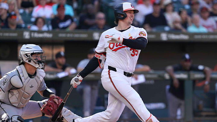 Sep 2, 2024; Baltimore, Maryland, USA; Baltimore Orioles catcher Adley Rutschman (35) drives in a run during the fifth inning against the Chicago White Sox at Oriole Park at Camden Yards. Mandatory Credit: Mitch Stringer-Imagn Images