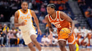 Texas guard Tramon Mark (12) drives past Tennessee guard Chaz Lanier (2) during the first half of a Southeastern Conference tournament quarterfinal game at Bridgestone Arena in Nashville, Tenn., Friday, March 14, 2025.