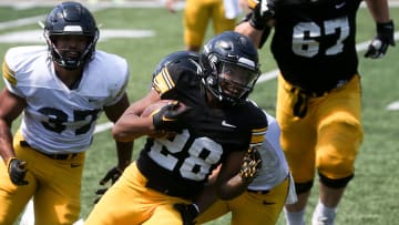 Iowa’s Kamari Moulton (28) runs with the ball during Kids Day at Kinnick Saturday, Aug. 10, 2024 at Kinnick Stadium in Iowa City, Iowa.