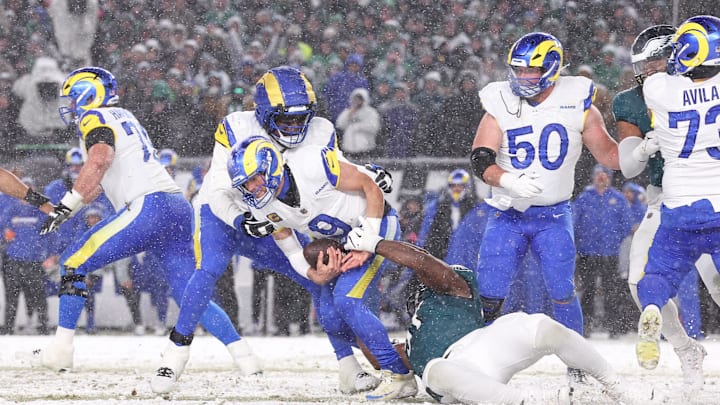  Los Angeles Rams quarterback Matthew Stafford (9) is sacked by Philadelphia Eagles defensive tackle Moro Ojomo (97) in the second half in a 2025 NFC divisional round game at Lincoln Financial Field. 