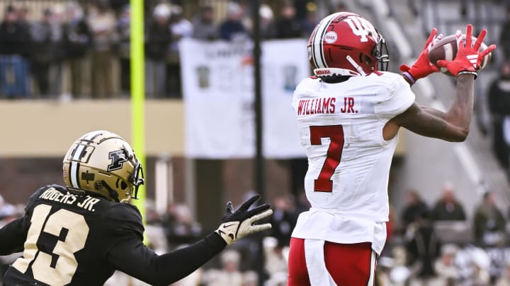 Indiana Hoosiers wide receiver E.J. Williams Jr. (7) catches a pass in front of Purdue Boilermakers defensive back Derrick Rogers Jr. (13)  at Ross-Ade Stadium. 